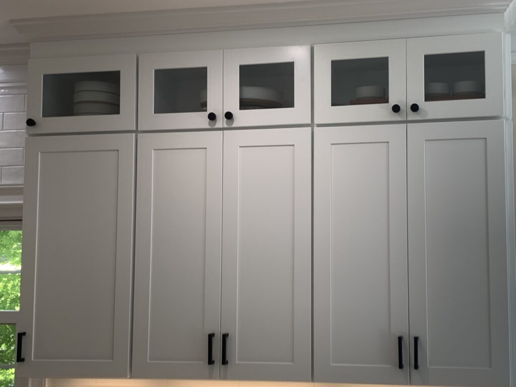 Selection of 34-inch wall cabinets in various styles and finishes, showcasing options for kitchen, bathroom, and laundry room storage.